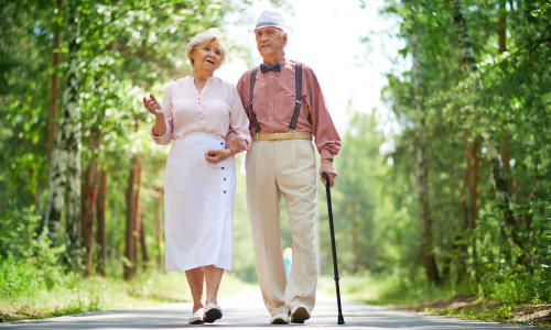 man and woman walking outdoors