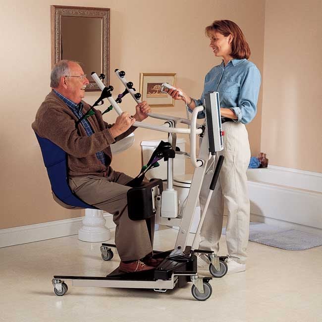 Invacare Sit to Stand patient lift using a commode sling